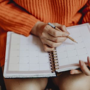 woman looking at calendar